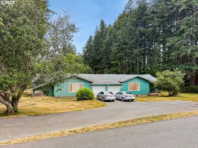 a car parked in front of white house