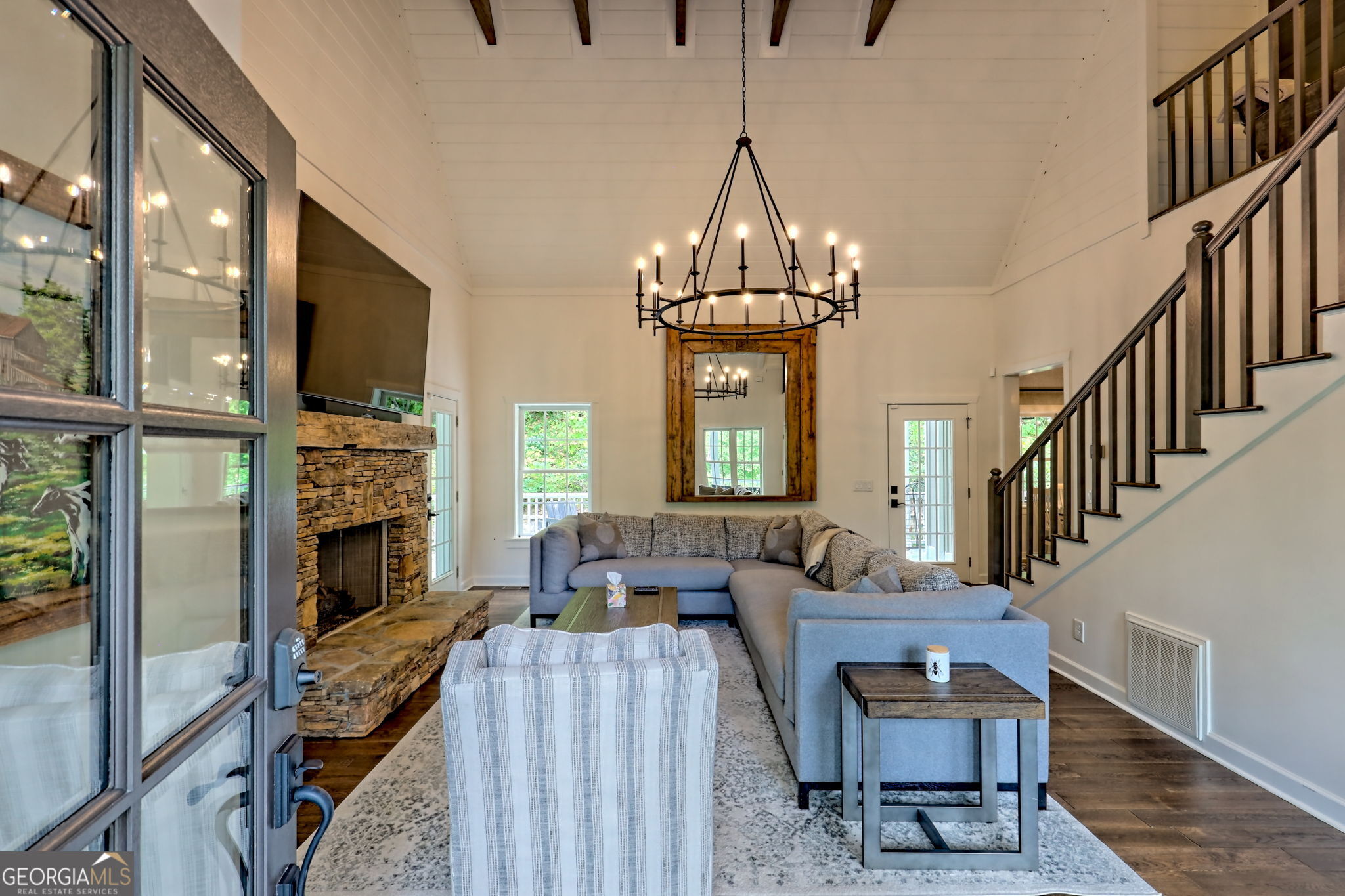 571 Ledford Road Dillard, GA 30537 - Photo 16 of 78 a living room with furniture a fireplace and a flat screen tv