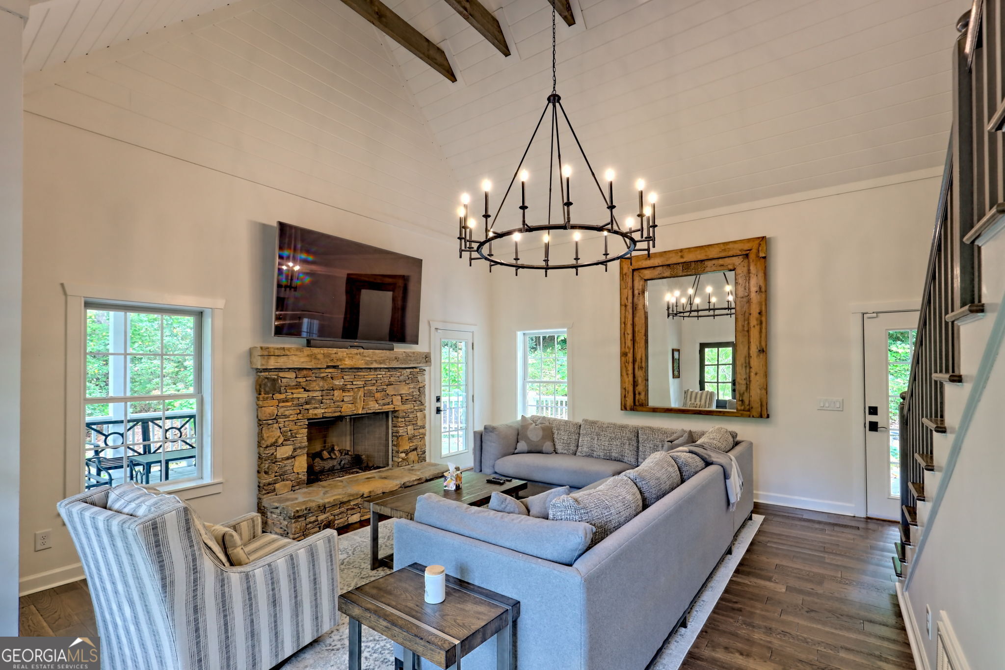 571 Ledford Road Dillard, GA 30537 - Photo 17 of 78 a living room with furniture a chandelier and a fireplace