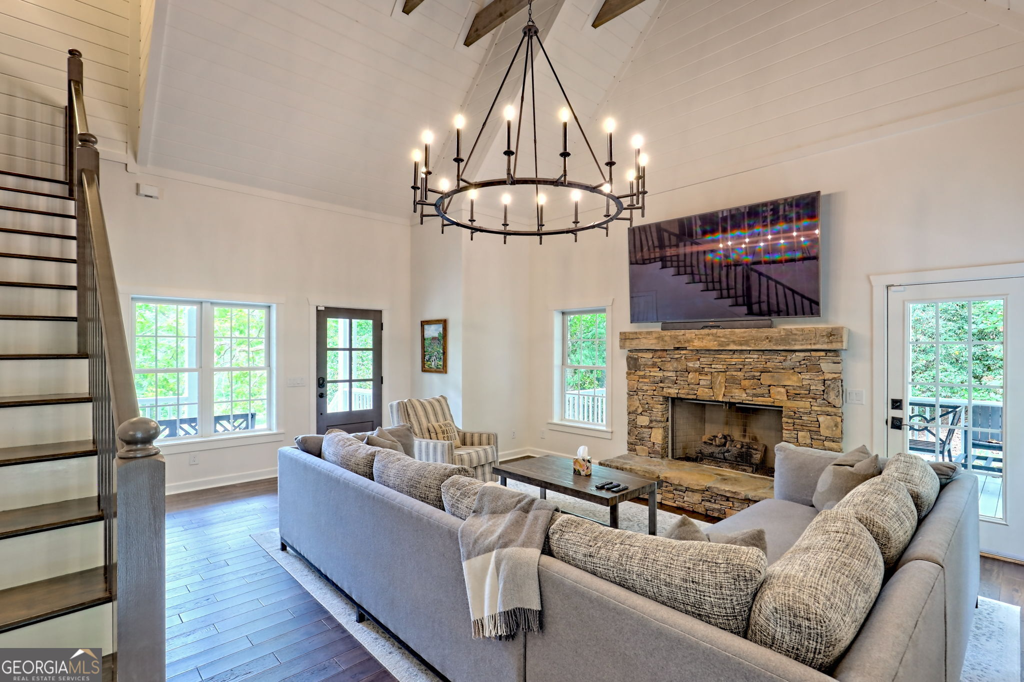 571 Ledford Road Dillard, GA 30537 - Photo 19 of 78 a living room with furniture a fireplace and a chandelier