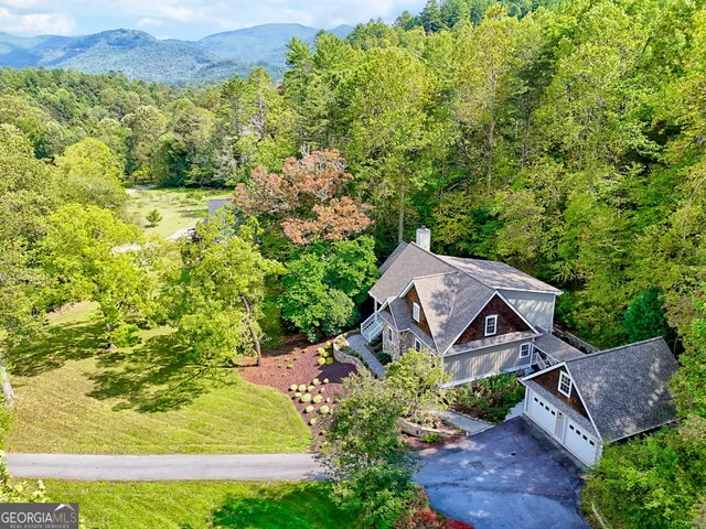 an aerial view of a house with a garden