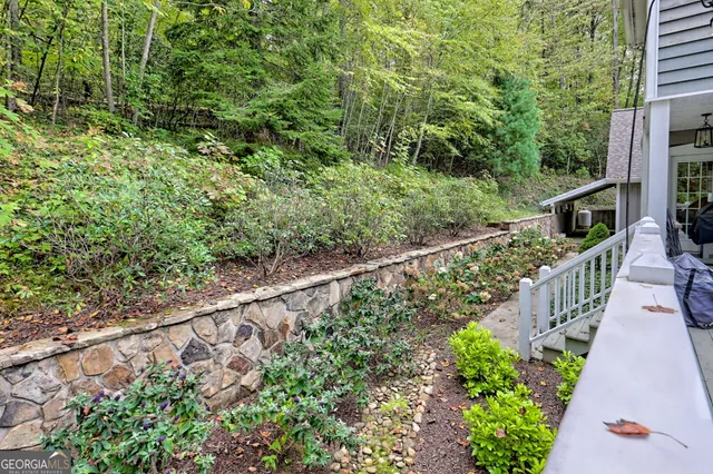 a en suite bathroom with a double vanity sink a mirror and a shower