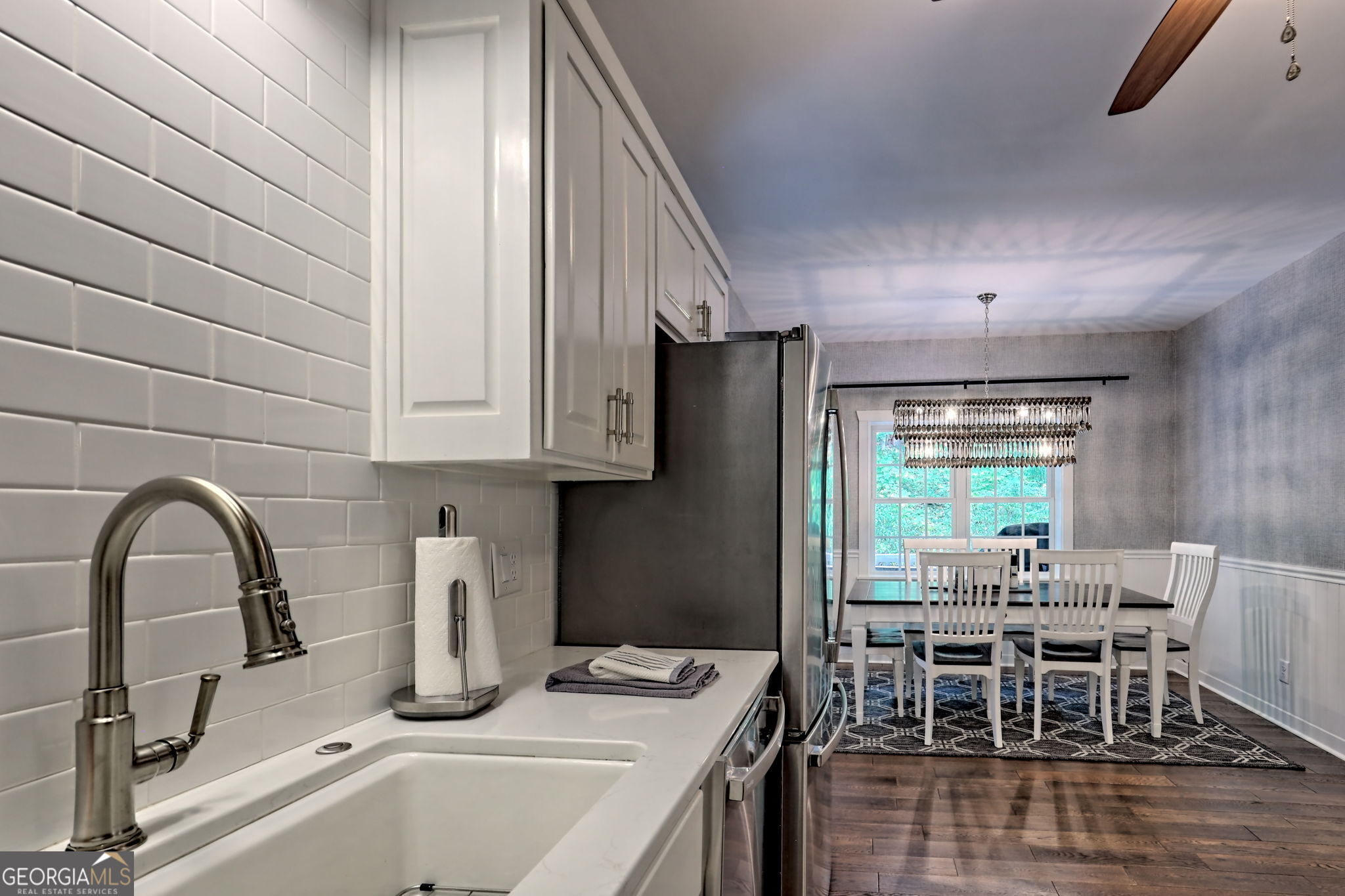 571 Ledford Road Dillard, GA 30537 - Photo 35 of 78 a kitchen with a table chairs and a sink