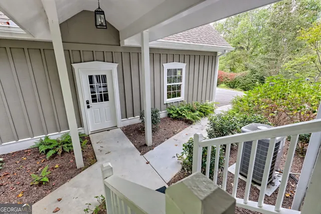 an aerial view of residential house with outdoor space and trees around