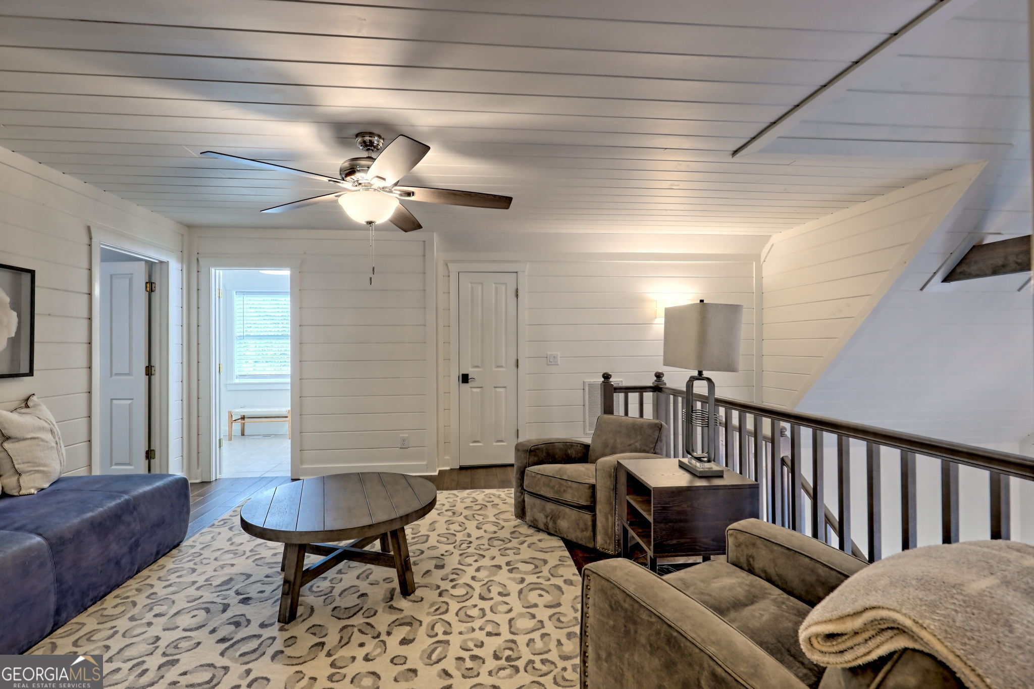 571 Ledford Road Dillard, GA 30537 - Photo 58 of 78 a living room with furniture and a chandelier
