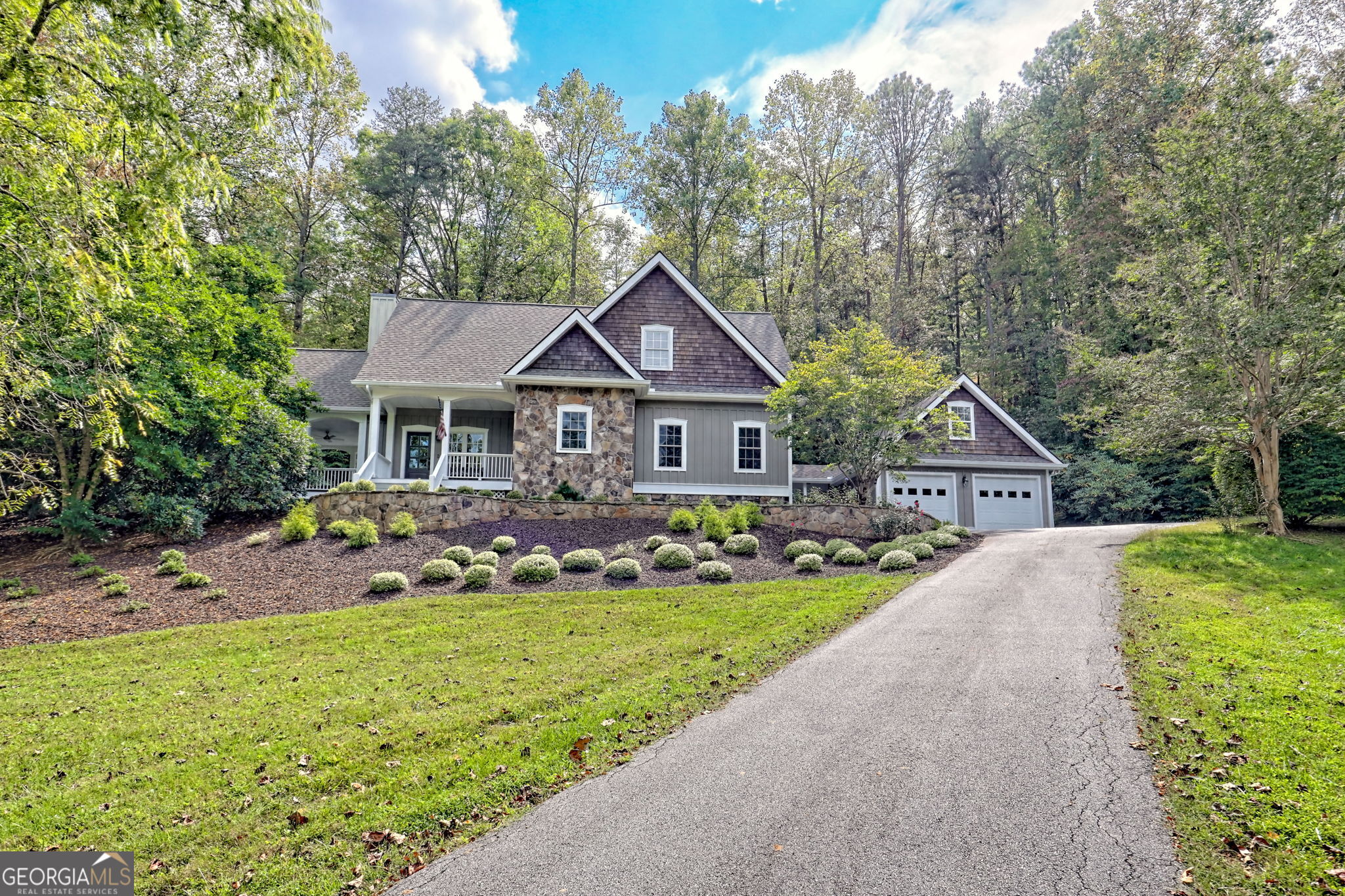 571 Ledford Road Dillard, GA 30537 - Photo 8 of 78 a front view of a house with a garden and trees