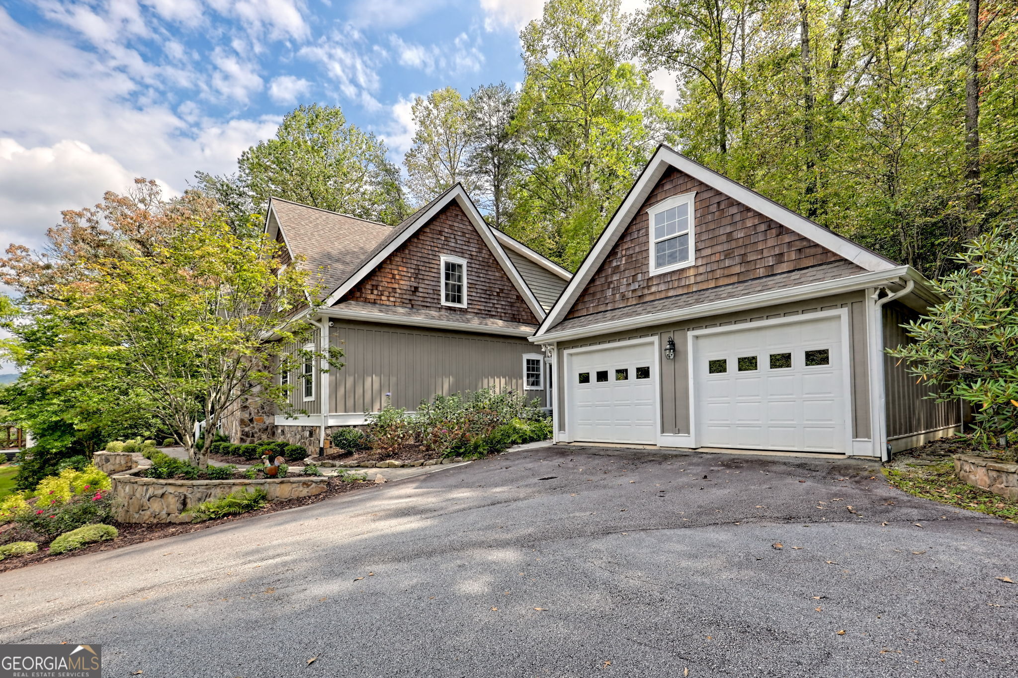 571 Ledford Road Dillard, GA 30537 - Photo 9 of 78 a front view of a house with a yard and garage