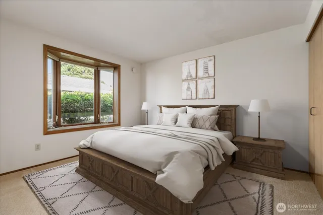 a bedroom with a bed and window