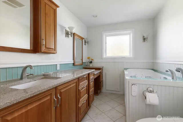 a utility room with a sink washer and dryer