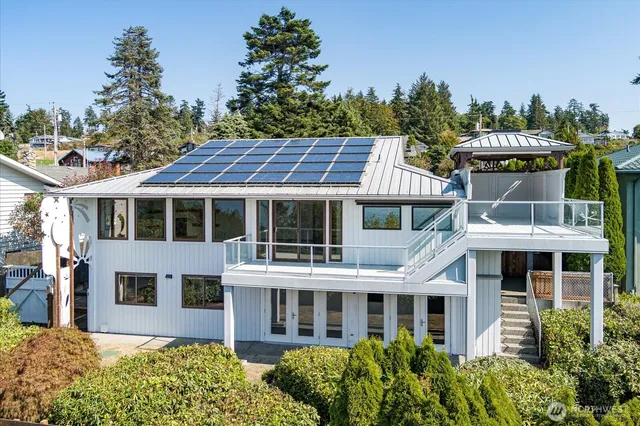 a front view of a residential apartment building with a yard