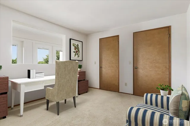 a view of a livingroom with furniture and windows