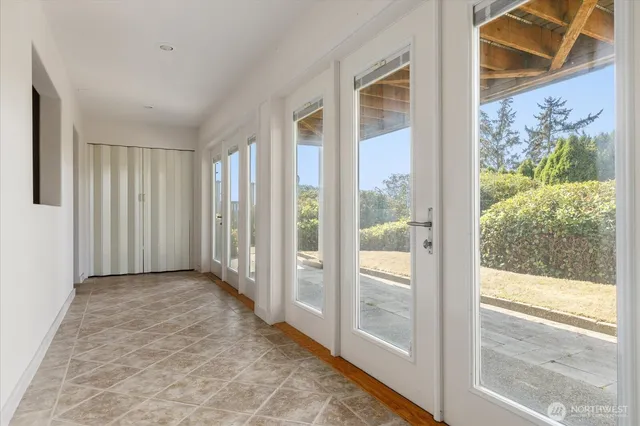 a view of entryway with wooden floor and door