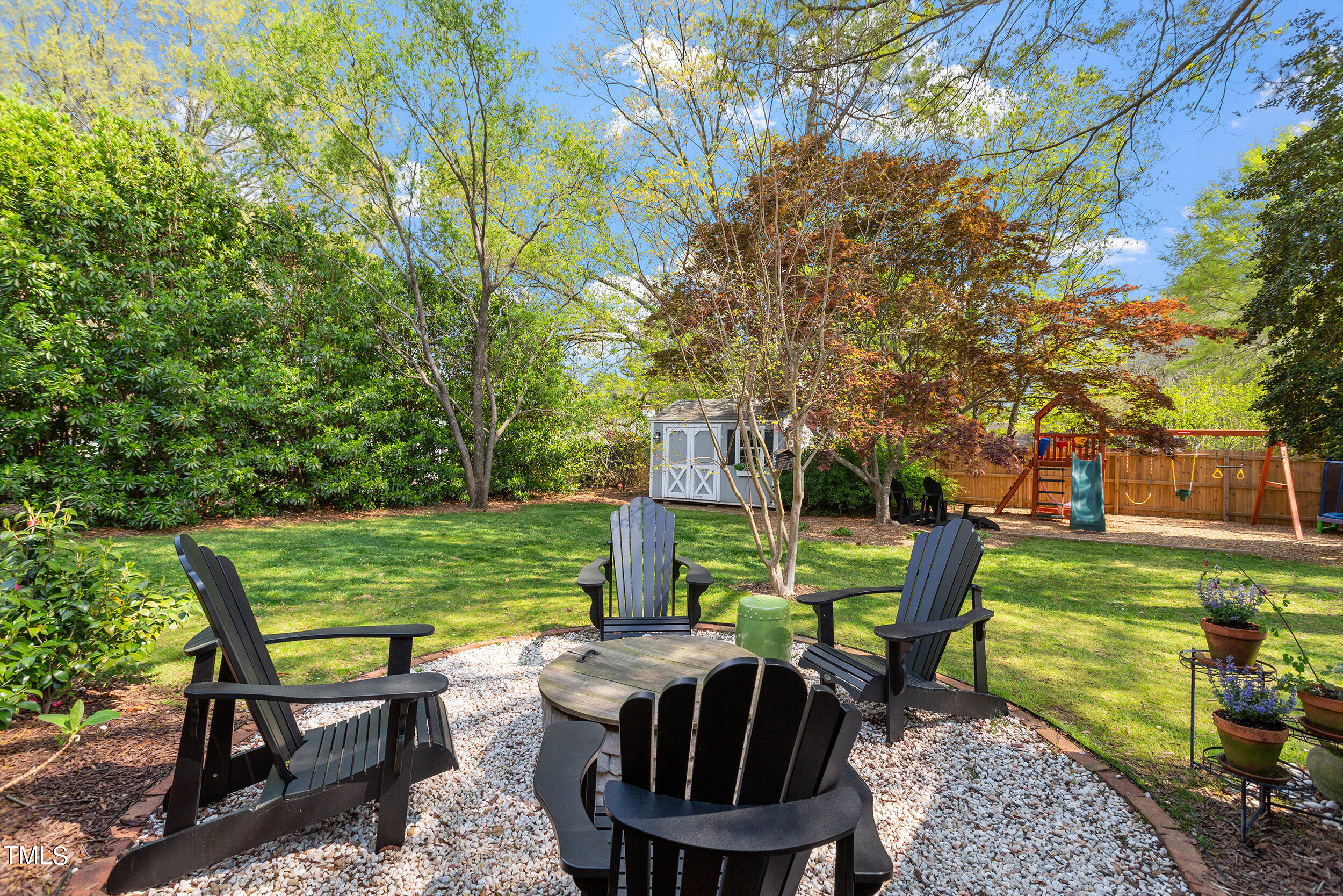 3316 Blue Ridge Road Raleigh, NC 27607 - Photo 29 of 35 a view of a table and chairs in the garden