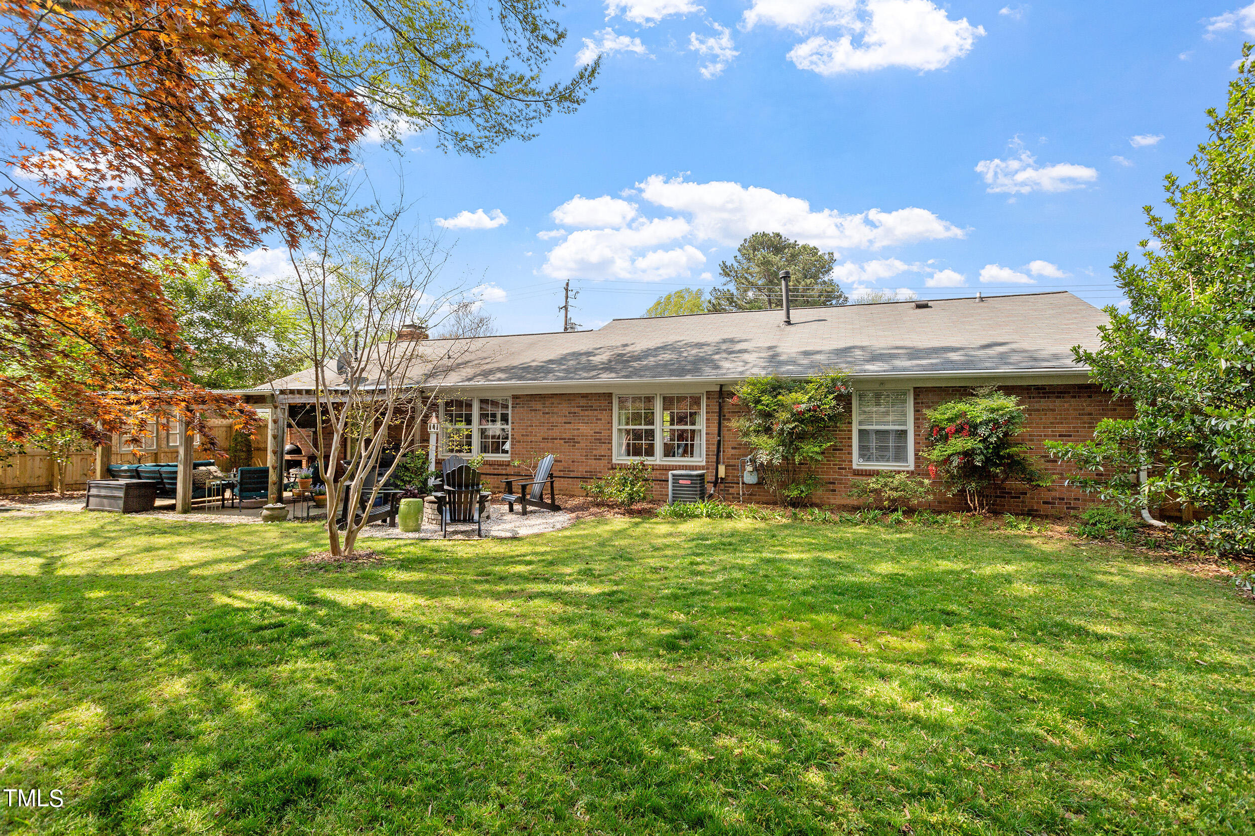 3316 Blue Ridge Road Raleigh, NC 27607 - Photo 33 of 35 a view of a house with a yard patio and fire pit