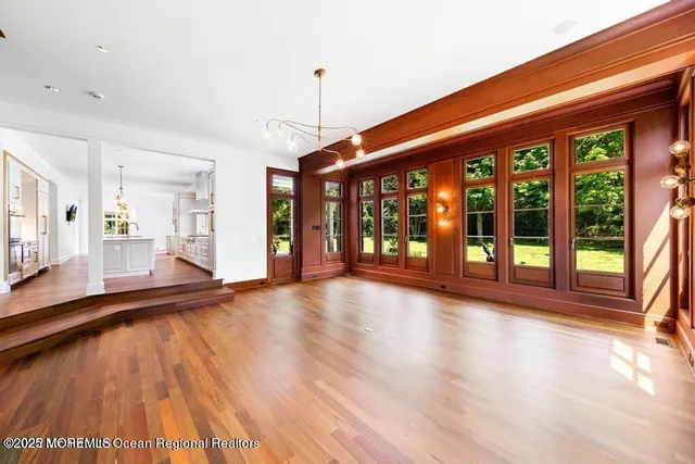 a livingroom with furniture wooden floor and windows