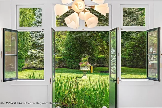 a view of a wooden door and a street