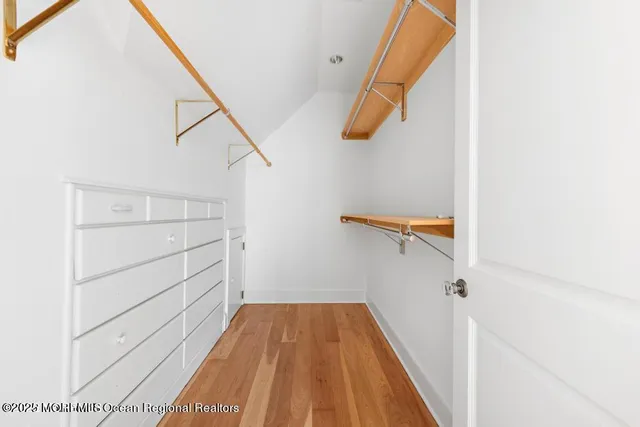 a kitchen with stainless steel appliances granite countertop a sink and dishwasher a stove with white countertops