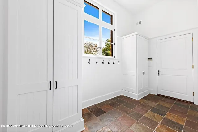 a kitchen with stainless steel appliances a stove and a sink