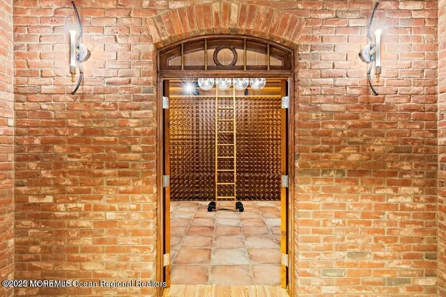 a view of a white house with a yard and potted plants