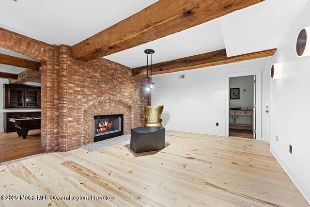 a view of a house with a yard and tree s