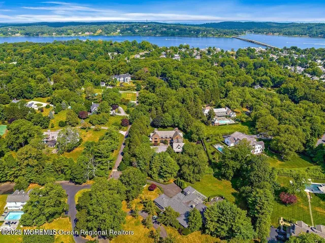 a kitchen that has a lot of cabinets and wooden floor