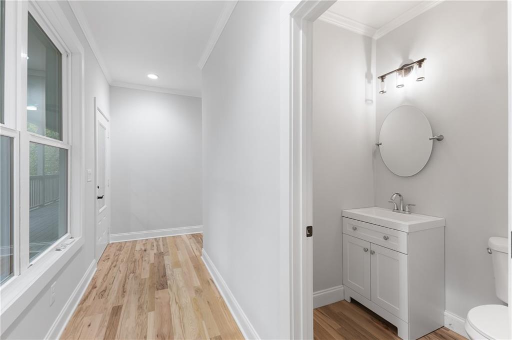 1713 Cagle Court Lawrenceville, GA 30045 - Photo 17 of 50 a bathroom with a sink toilet and shower