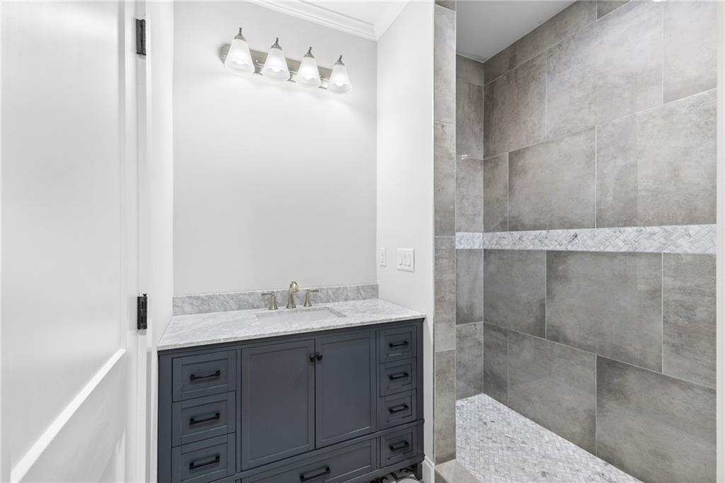 1713 Cagle Court Lawrenceville, GA 30045 - Photo 20 of 50 a bathroom with a sink and a mirror