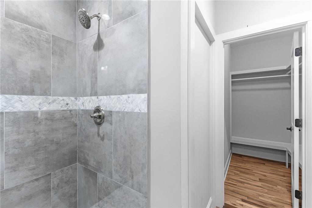 1713 Cagle Court Lawrenceville, GA 30045 - Photo 21 of 50 a bathroom with a shower