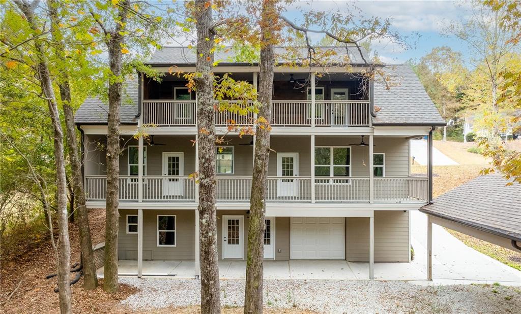 1713 Cagle Court Lawrenceville, GA 30045 - Photo 48 of 50 a front view of a house with glass windows and door