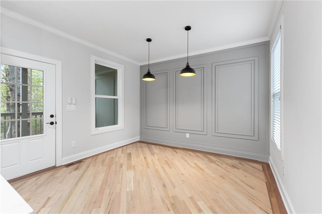 1713 Cagle Court Lawrenceville, GA 30045 - Photo 9 of 50 a view of empty room with wooden floor and fan