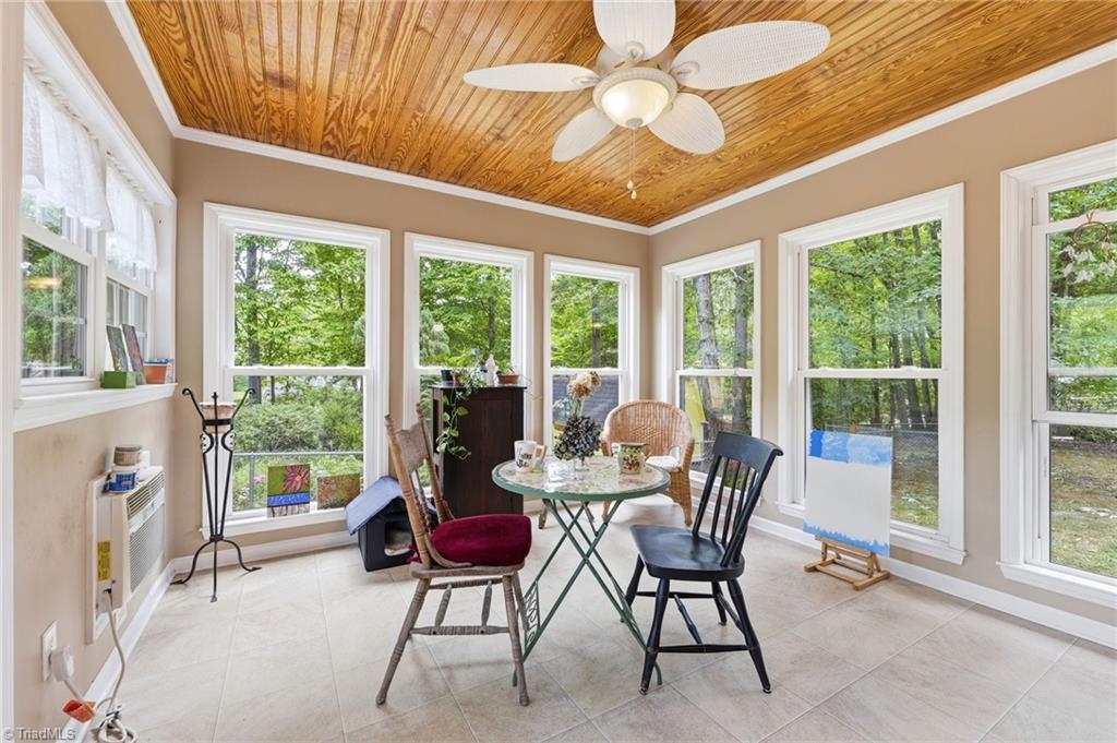 118 Honey Road Stokesdale, NC 27357 - Photo 27 of 39 Sunroom is heated and cooled by wall unit