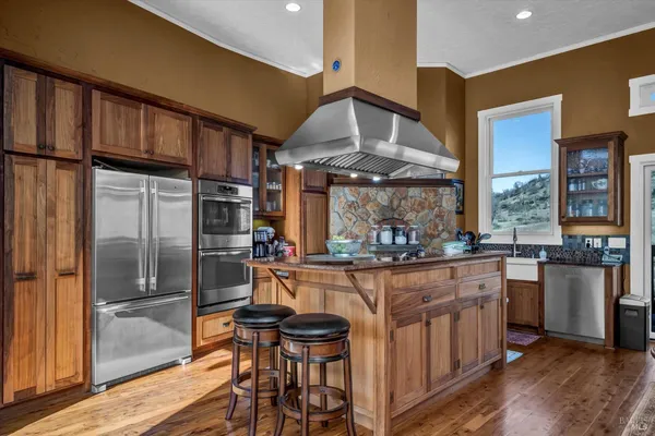 a kitchen with a table and chairs