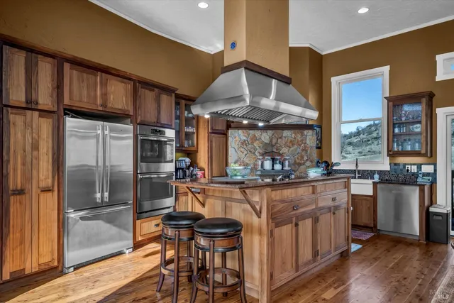 a kitchen with a table and chairs
