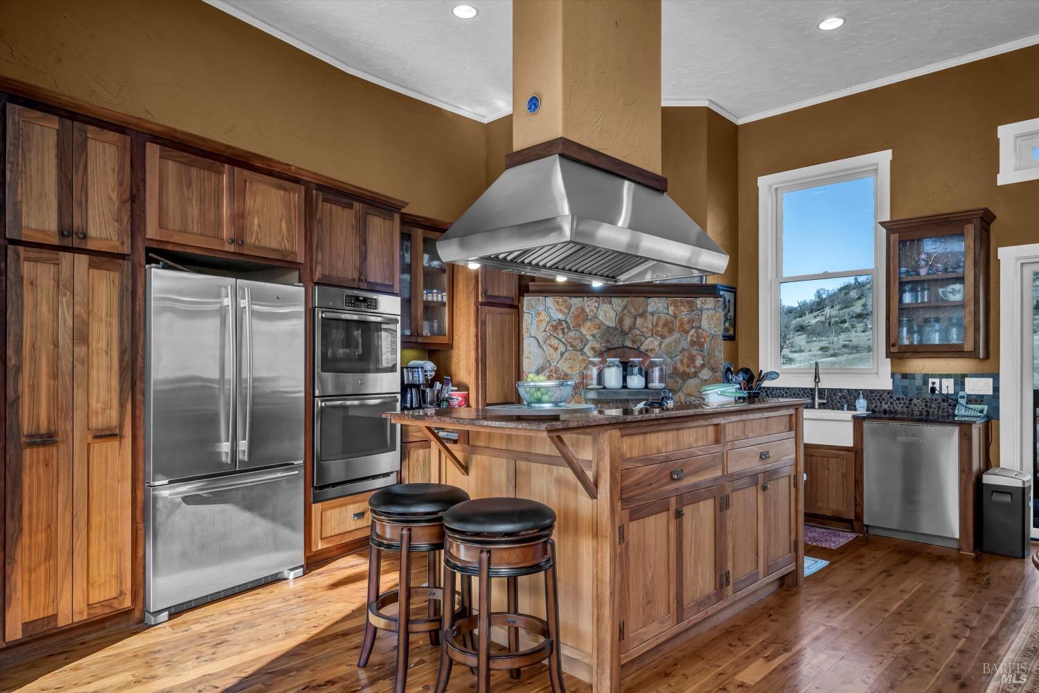 1900 Stagecoach Canyon Road Pope Valley, CA 94567 - Photo 11 of 70 a kitchen with stainless steel appliances granite countertop a stove and cabinets