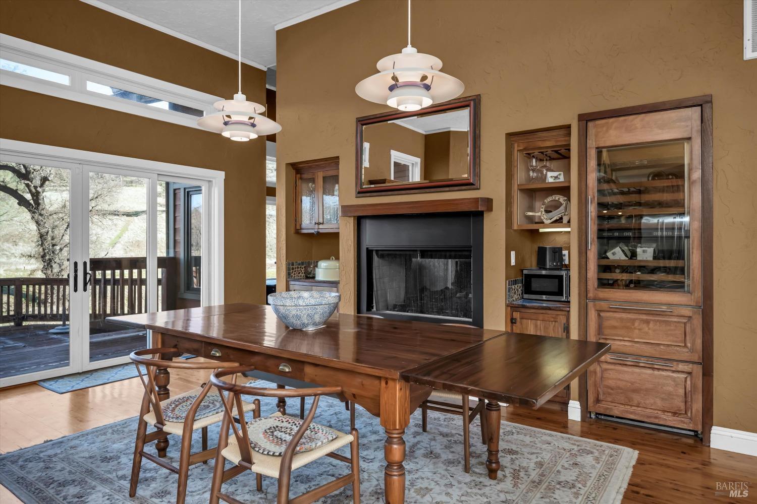 1900 Stagecoach Canyon Road Pope Valley, CA 94567 - Photo 13 of 70 a dining room with furniture a chandelier and wooden floor