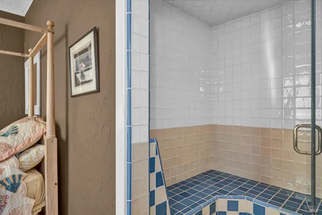 a bathroom with a granite countertop toilet and a sink