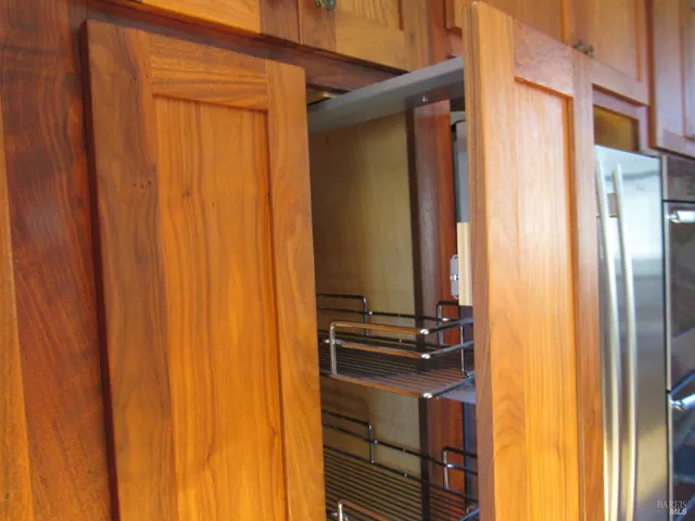 a bathroom with a granite countertop toilet and a sink
