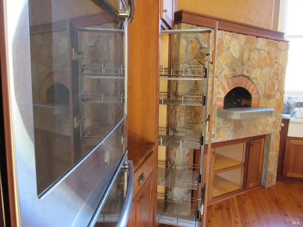 a living room with furniture a rug and a large window