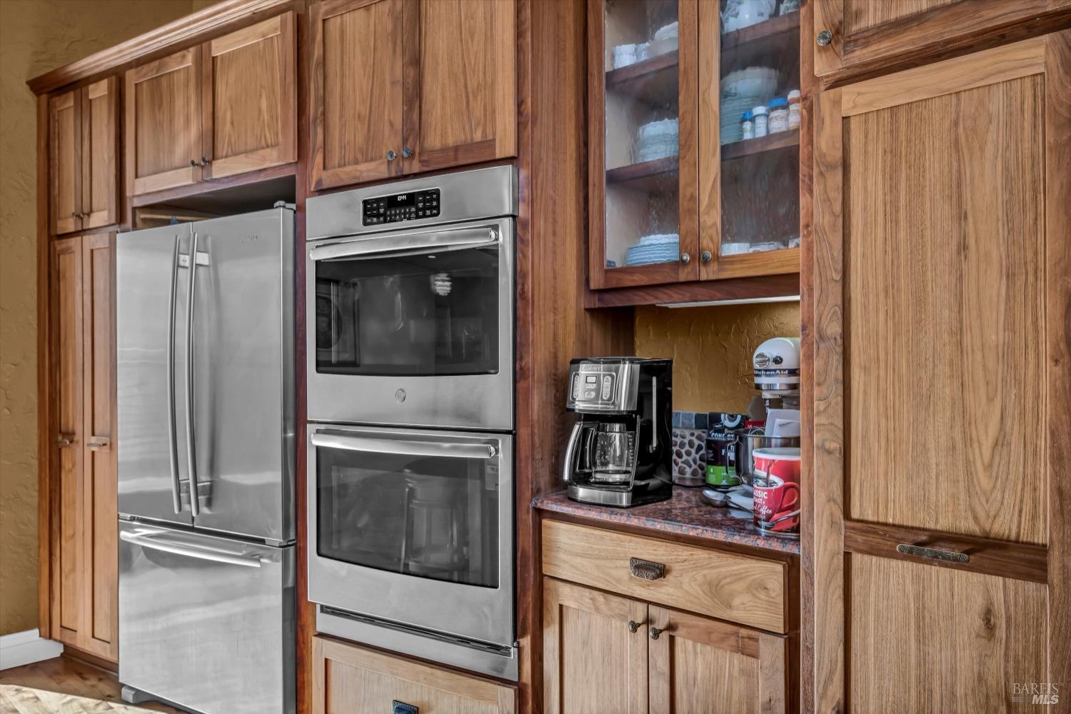 1900 Stagecoach Canyon Road Pope Valley, CA 94567 - Photo 21 of 70 a kitchen with stainless steel appliances granite countertop a refrigerator and cabinets