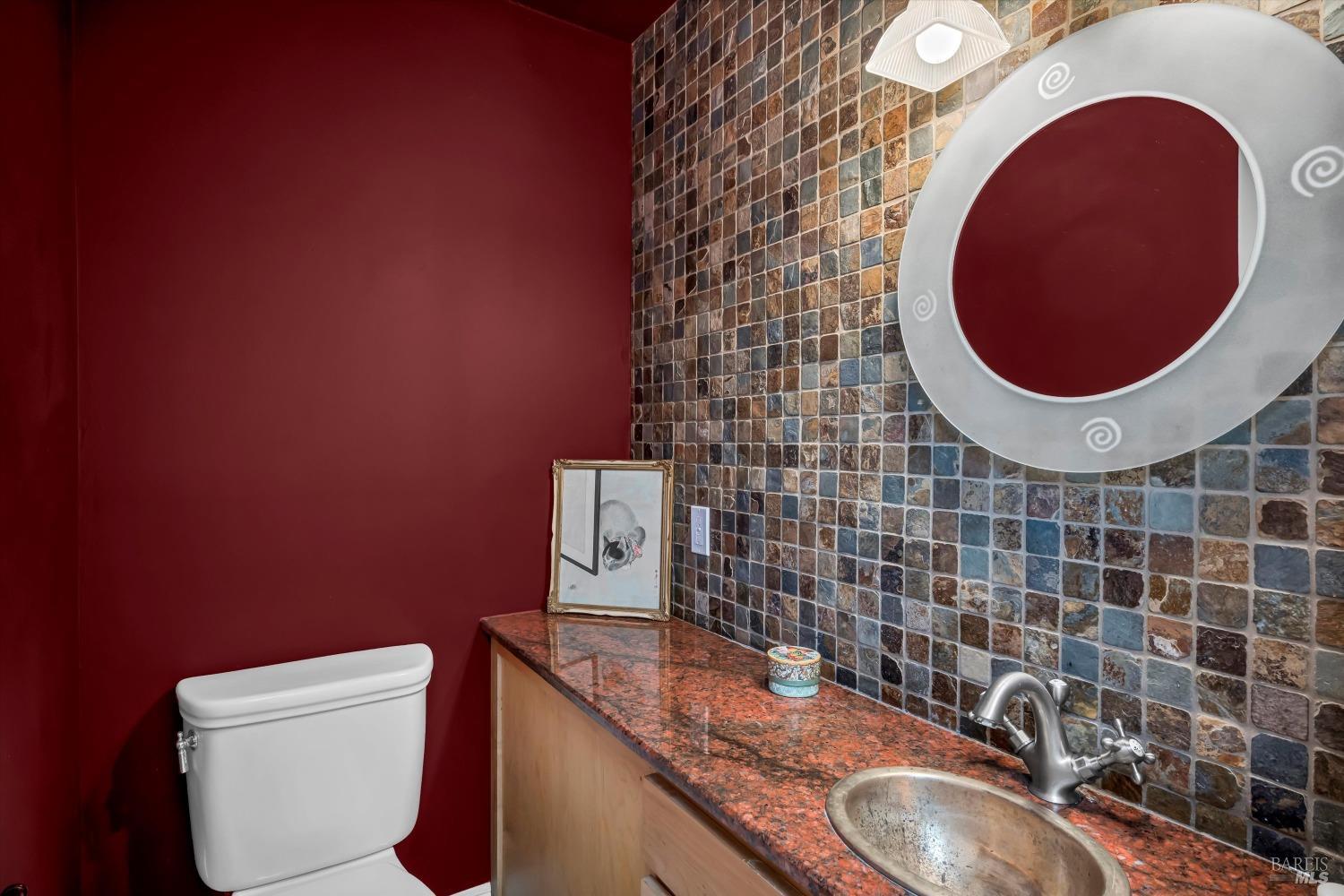 1900 Stagecoach Canyon Road Pope Valley, CA 94567 - Photo 25 of 70 a bathroom with a granite countertop toilet and a sink