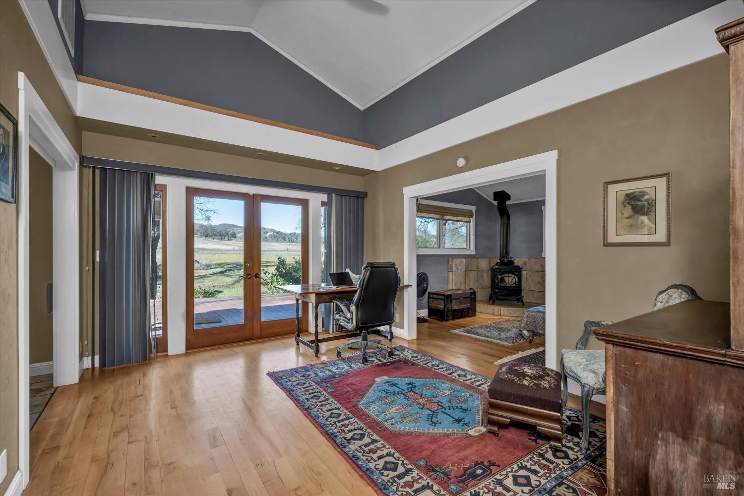 1900 Stagecoach Canyon Road Pope Valley, CA 94567 - Photo 26 of 70 a living room with furniture a rug and a large window