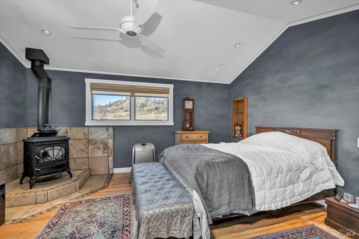 1900 Stagecoach Canyon Road Pope Valley, CA 94567 - Photo 28 of 70 a bedroom with a bed and wooden floor