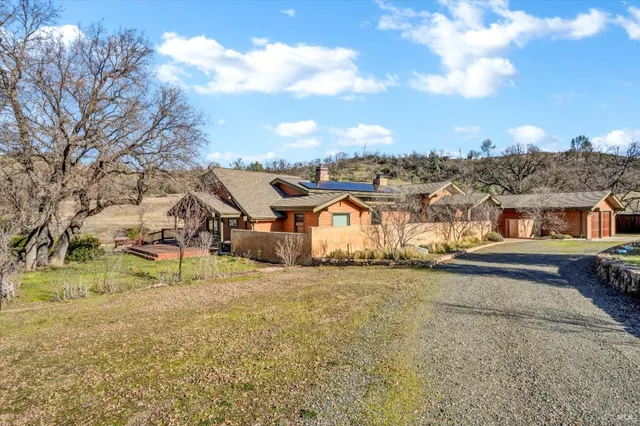 a backyard of a house with lots of green space