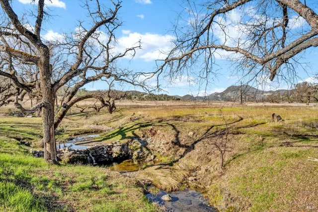 a view of a patio with a table and chairs
