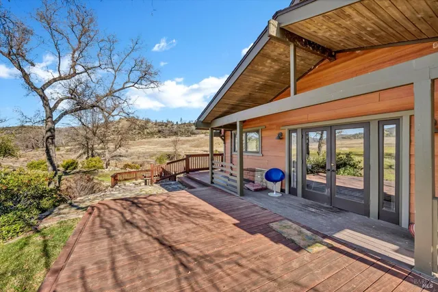 a view of a yard with large trees