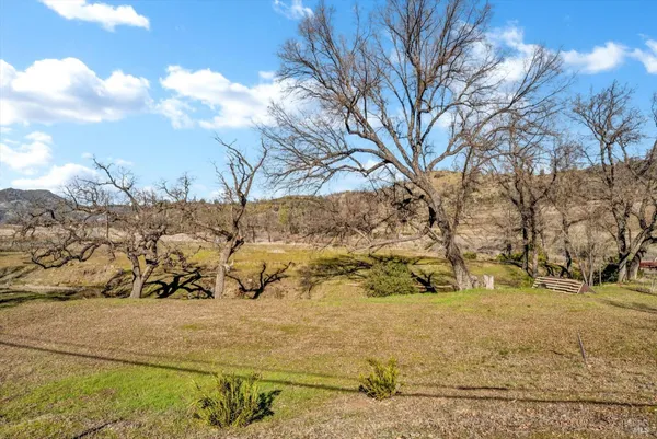 a view of house with yard and mountain view