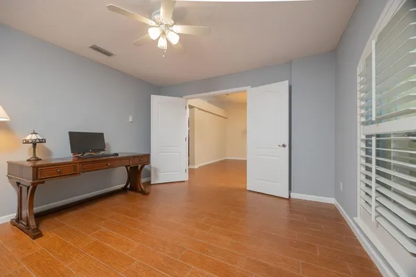 a view of a livingroom with furniture and a window