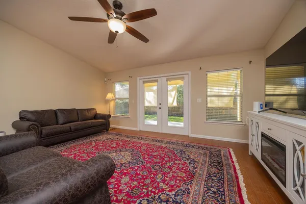 a living room with furniture fireplace and flat screen tv