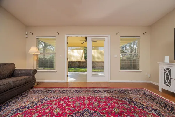a living room with furniture and a rug