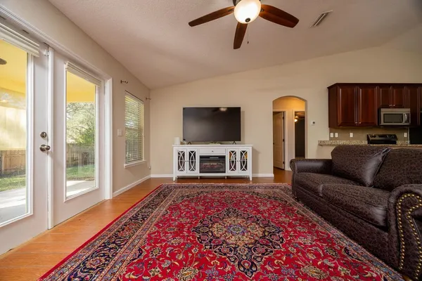 a living room with furniture and a flat screen tv